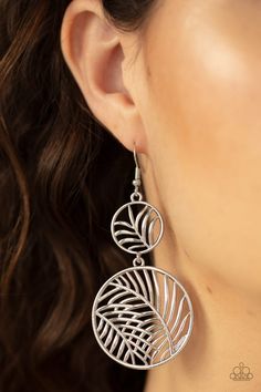 Featuring lifelike palm leaf patterns, a dainty silver frame connects to a larger silver frame, creating a whimsically stacked lure. Earring attaches to a standard fishhook fitting. Sold as one pair of earrings. Silver Leaf-shaped Jewelry With Ear Wire, Silver Adjustable Fish Hook Earrings, Silver Leaf-shaped Metal Earrings, Silver Dangle Earrings With Fish Hook, Silver Leaf-shaped Metal Jewelry, Palm Leaves Pattern, Leaf Patterns, Paparazzi Accessories, Silver Box