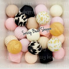 assorted bead shoppe beads in a white box with the words sassy bead shoppe on it