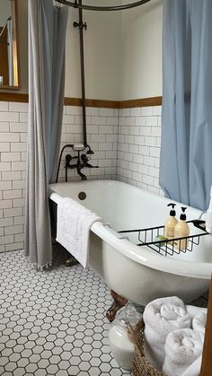 a white bath tub sitting next to a window