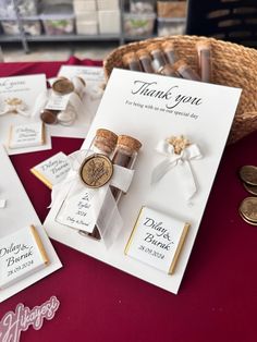 a table topped with lots of wine corks and place cards for guests to sign