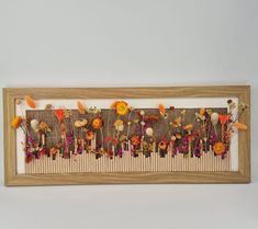 a wooden frame with flowers on it