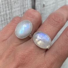 Vertical or Horizontal Set Large Oval White Rainbow Moonstone Sterling Silver Statement Ring | June Birthstone Ring | Moonstone Ring by GildedBug on Etsy White Oval Moonstone Ring With Large Stone, White Oval Moonstone Ring In Minimalist Style, Silver Oval Moonstone Ring With Natural Stones, White Oval Moonstone Ring, Large Oval White Moonstone Ring, Minimalist Oval Moonstone Ring With Natural Stones, Adjustable White Oval Moonstone Ring, Oval Moonstone Ring With Large Stone, Adjustable Oval White Moonstone Ring