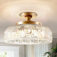 a chandelier hanging from the ceiling in a living room