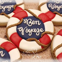 decorated cookies are arranged in the shape of life preservers with words born voyage written on them