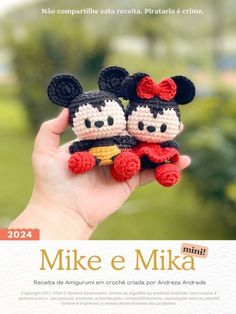 two crocheted mickey and minnie mouses are shown in front of an advertisement