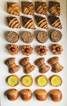 a white table topped with lots of pastries