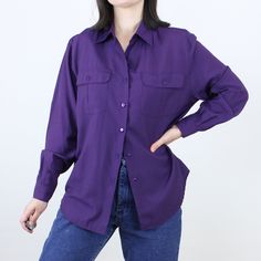 Item Description  This is a nice rayon blend vintage 90s dark purple collared shirt with long sleeves, button cuffs, and flap pockets on the chest that have button closures. I love how moody the dark purple color is!! This is such a great versatile piece for dressing both up and down, and the fabric is so soft and comfy! This shirt is in great condition and ready to wear, with no flaws to note.  Item Specifics  Brand - Lisa Josephs Material - 60% Rayon, 40% Polyester Color - Purple Measurements Cheap Purple Button-up Tops, Purple Collared Shirt Outfit, Solid Color Shirt With Lapel Collar For Fall, Fitted Long Sleeve Blouse With Pockets, Trendy Collared Shirt For Fall, Solid Shirt With Collared Neckline For Fall, Solid Collared Shirt For Fall, Trendy Fall Shirt With Lapel Collar, Relaxed Fit Shirt With Collared Neckline For Fall