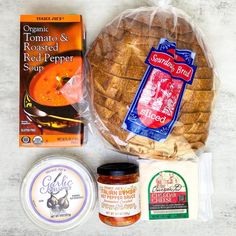 bread, cheese and other food items laid out on a table