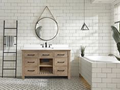 a bathroom with a sink, mirror and bathtub in it's center area