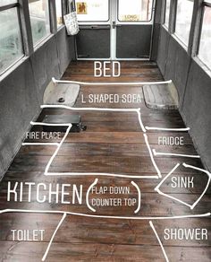 the inside of an rv with wood flooring and different types of kitchen items on it