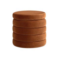 six round stools stacked on top of each other in front of a white background