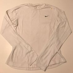 Nike White Dri-Fit Long Sleeve. Nwot- It Has Never Been Work, But I Have Washed It By Mistake. The Plastic Portion Of The Tag Is Still Attached, But The Tag Itself Did Not Make It Through The Laundry. It's The Softest Nike Shirt I've Purchased, Just Unfortunately Doesn't Fit. It Is A Slimmer Cut. (Sorry For The Wrinkles, It Has Been Stored In Closet And That Kind Of Fabric) Girl Wishlist, Nike Long Sleeve Shirt, Tops Nike, Nike Long Sleeve, Nike Shirt, Kinds Of Fabric, White Long Sleeve Shirt, Nike White, Clean Girl