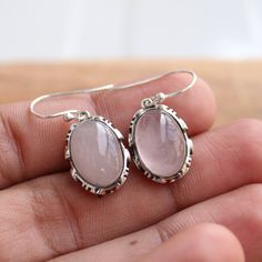 Gemstone - rose quartz Gemstone Size - 10x14 oval Metal - Sterling Silver Natural rose quartz sterling silver Earrings, Same design ring is also uploaded https://www.etsy.com/in-en/GemsNjewelrystudio/listing/752776088/rose-quartz-sterling-silver-ring-gift?utm_source=Copy&utm_medium=ListingManager&utm_campaign=Share&utm_term=so.lmsm&share_time=1600957399075 The earrings can be customized on request and the gemstone can be switched to any gemstone you want. Feel free to contact me Natural Stones Jewelry With Rose Quartz, Rose Quartz Jewelry With Natural Stones, Dainty Oval Jewelry With Natural Stones, Dainty Oval Natural Stone Jewelry, Silver Rose Quartz Jewelry With Natural Stones, Silver Jewelry With Natural Stones In Rose Quartz, Pink Oval Sterling Silver Jewelry, Oval Pink Sterling Silver Jewelry, Dainty Oval Cabochon Jewelry