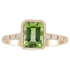 Stunning, timeless and classy eternity Unique Ring. Decorate yourself in luxury with this Gin & Grace Ring. The 14K Yellow Gold jewelry boasts with Emerald-Cut Peridot (1 pcs) 1.64 carat accent stones for a lovely design. This Ring is weight 2.23 grams. Crafted with 14K Yellow Gold, this delicate Ring is polished to a high finish shine. Green Gemstone Ring, Yellow Gold Jewelry, Peridot Ring, Green Gemstones, Delicate Rings, White Diamond, Yellow Gold Rings, Unique Rings, Gin