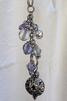 a necklace with several charms hanging from it