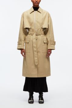 Distilled with a nonchalant spirit, this coat riffs on the classic trench. It's cut from cotton twill to a relaxed silhouette accentuated by hallmark details like storm flaps, a belted waist and button tabs at the cuffs. Adjust the zip at the chest for convertible styling. Cotton twill Point collar Long sleeves with bu Classic Khaki Outerwear With Belted Cuffs, Classic Khaki Belted Outerwear, Oversized Belted Gabardine Outerwear, Belted Beige Cotton Outerwear, Khaki Belted Gabardine Outerwear, Spring Gabardine Outerwear With Belt Loops, Khaki Gabardine Belted Outerwear, Spring Cotton Outerwear With Belt Loops, Army Colors