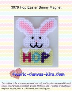 an easter bunny made out of plastic beads with the word happy in it's center