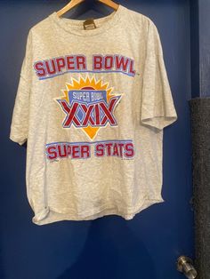 Super Bowl 29 Super Stats T-shirt has all the statistics of previous Super Bowls from 1967 - 1994. Men's Size XL. In good vintage used condition. Vintage Wedding Favors, Old Portraits, Retro Tee, Ash Grey, Super Bowl, Vintage Colors, Cotton Material, Womens Tops, Mens Graphic Tshirt