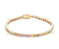 Rainbow sapphire bezel tennis bracelet gold | Natural multi sapphire round bezel bracelet gold | Round  multi sapphire colorful bracelet  GEMSTONE DETAILS : ✦ Gemstone : Rainbow Sapphire ✦ Gemstone Type : Natural ✦ Gemstone Size : 2.5 MM ✦ Gemstone Shape : Round ✦ Gemstone Weight : 4.84 carats ✦ Gemstone Grade : AAA METAL DETAILS : ✦ Metal : 14K/18K Gold ✦ Metal Color : Yellow / White / Rose Gold ✦ Setting : Bezel ✦ Bracelet Box : Yes SHIPPING DETAILS : ✦ Shipped via : USPS ✦ Production time : 1 Yellow Gold Multi-stone Tennis Bracelet, Multicolor Round Jewelry With Bezel Setting, Multicolor Round Bezel Set Jewelry, Multicolor Jewelry With Bezel Setting, Multicolor Gemstone Tennis Bracelet, Multicolor Multi-stone Round Tennis Bracelet, Tennis Bracelet Gold, Bezel Bracelet, Colorful Bracelet