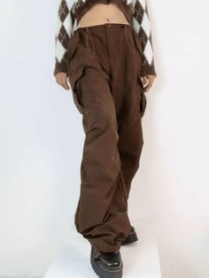 ⚡Buy 2023 Vintage Brown Baggy Parachute Cargo Pants Brown M under $44.00 in Pants at AnotherChill.com Online. Style: Casual/Street/Hip Pop/Punk/Y2K/Vintage. Fabric Content: Polyester Blend. Fit Type: Relax fit. : Step up your fashion game with these vintage-inspired parachute cargo pants. Perfect for festival seasons, these pants offer a relaxed fit and feature a drawstring detail at the waist and cuffs. Complete with functional pockets and a button zip fastening, they're a must-have addition to Cargo Pants Brown, Parachute Cargo Pants, Parachute Cargo, Drawstring Detail, Pants Brown, Pre Fall Collection, Bodycon Floral Dress, Y2k Vintage, Pantalon Cargo