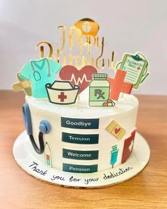 a birthday cake decorated with medical related items and congratulations messages for someone's special occasion