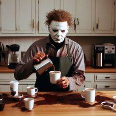 a man dressed as the joker pours coffee from a mug on a kitchen counter