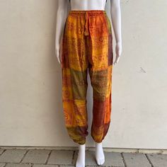 Earth toned patchwork pants  Stonewashed to create a unique design  Easy to wear with an elastic waist and drawstring  Lightweight and casual so it's easy to wear  Hippie/Boho style pants. 100% Rayon One size  Length 40in Made in Nepal 🇳🇵  Please message with any questions! #hippie #cottonpants #boho #patchwork #nepal Casual Patchwork Harem Pants, Multicolor Relaxed Fit Bottoms With Drawstring, Casual Festival Pants With Patchwork, Casual Patchwork Pants For Festival, Baggy Patchwork Harem Pants, Bohemian Patchwork Harem Pants, Bohemian Relaxed Fit Harem Pants With Drawstring, Festival Harem Pants With Patchwork, Casual Multicolor Drawstring Pants