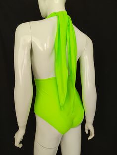 "FREE SHIPPING TO USA FOR ALL ORDERS OVER 35$! Choose right size by following our size chart below, thank you! We use FEDEX PRIORITY shipping service to the United States to guarantee the fastest delivery in 3-4 days. Flattering one piece swimsuit in neon green fabric with open back and high cut. It has a deep neckline secured at the back of the neck with a halter tie. Stretchy and body fitting material. COLOR: NEON GREEN MEASUREMENTS: X-Small - Bust - 32\" - 34\" (82-86 CM) - Hips - 35\" - 36\" High Stretch Solid Leotard For Beach, High Stretch Solid Color Leotard For Beach, Green Stretch T-back Swimwear, High Stretch Leotard For Beach, Solid High-stretch Beach Leotard, High Stretch Summer One-piece Bodysuit, Summer Nylon Dancewear Bodysuit, Beach Leotard In Solid Color With Stretch, Summer Dancewear Nylon Bodysuit