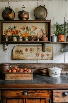 an old fashioned kitchen with pots and pans on the shelf above the stove top