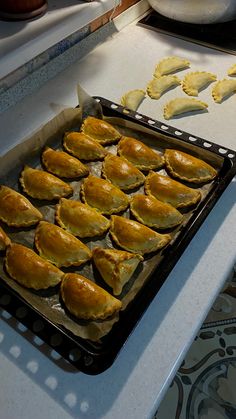 there are many pastries in the pan on the counter