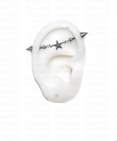 a white ear with two silver stars on it