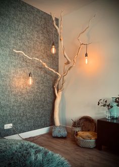 a room with a tree and some lights on the wall