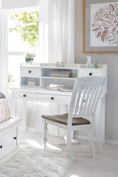 a white desk and chair in a room