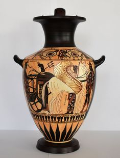 a vase with an image of a horse and carriage painted on it's side