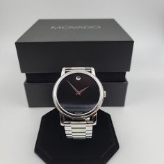 Brand New, Never Used, Comes With Movado Box. 100% Authentic Modern Silver Watch Accessories For Formal Occasions, Formal Silver Watch Accessories With Analog Display, Black Watch With Polished Finish, Black Round Watch Accessories With Polished Finish, Modern Watch Accessories For Anniversary, Silver Business Jewelry With Round Dial, Modern Silver Jewelry And Watches For Formal Occasions, Modern Black Jewelry And Watches For Formal Occasions, Silver Business Watches With Diamond Hour Markers