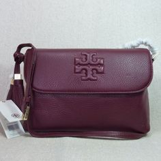 Brand New Never Been Carried. Last Piece In Stock. Thea Messenger By Tory Burch. This Bag Is Made Of Cabernet Pebbled Genuine Leather. This Bag Is Perfect As A Daily Use Bag. Dimensions: 10.5" Wide Across Bottom X 8" Tall Center X 3.75" Deep. Long Strap Maximum Length 53". Flap Closure Single Compartment Interior: 1 Zipper Pocket And 2 Slip Pockets 1 Slip Pocket At The Back Of The Bag For Your Keys Or Phone. Fabric Lining. Gold Tone Metalware. Outlet Item Doesn't Come With Dust Bag But Will Prov Tory Burch Crossbody Handbags, Leather Crossbody Bag Tory Burch, Tory Burch Messenger Bag, Tory Burch Bag, Kate Spade Crossbody, Pebbled Leather, Red Gold, Cross Body, Zipper Pocket