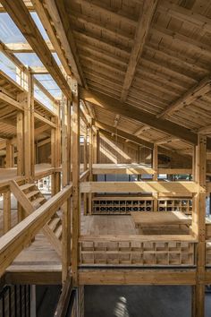 the inside of a building with wooden floors and beams on it's sides, as seen from above