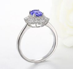 Welcome to Elegant Art Jewelry!  Material: 925 Sterling Silver Stone: Lab Tanzanite, Emerald, Ruby Stone Size: 6mm×8mm Gemstone Cut: Oval Cut Side Stone: Zircon Personalization: 9K/14K/24K/GOLD/SILVER/PLATINUM/ROSE-GOLD/WHITE GOLD. (Contact me)  Tanzanite Ring, Tanzanite Cuff Ring, 925 Sterling Silver Ring, Round Shape Ring, Tanzanite Ring, Tanzanite Engagement, Open Design Ring, Tanzanite Oval, Tanzanite Natural, Blue Tanzanite , Blue Gemstone, Gemstone Ring, Engagement Ring, Statement Ring, We Oval Tanzanite Diamond Wedding Ring, Silver Sapphire Ring With Baguette Cut And Halo Setting, Tanzanite Halo Ring For Wedding, Oval Tanzanite Wedding Ring, Silver Pear-shaped Halo Ring, Silver Pear-shaped Halo Ring For Wedding, Silver Pear-shaped Crystal Ring For Formal Occasions, Pear-shaped Silver Halo Ring For Wedding, Elegant Silver Pear-shaped Halo Ring