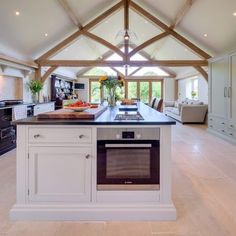 a large kitchen with an island in the middle