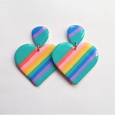 Cute fun and flirty heart dangle earrings!These Dangle Drop Earrings are handmade from scratch in my home studio. I hand-paint each piece with special paint.  Each pair is a unique piece of art, with no two earrings looking exactly alike. Even the pair of earrings are sisters, not twins!Each piece of these earrings are handmade by me in my studio, each piece is unique and each piece is ensured to be fair trade because I'm in charge of each step of the process!!These earrings have two tiers, all Unique Hand Painted Heart Earrings, Hand Painted Multicolor Heart Earrings For Gift, Hand Painted Multicolor Heart Earrings As Gift, Playful Hand Painted Dangle Earrings, Playful Hand-painted Dangle Earrings, Fun Hand Painted Colorful Earrings, Multicolor Fun Heart Earrings, Cute Multicolor Earrings With Heart Charm, Hand Painted Multicolor Heart Earrings