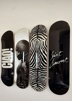 four skateboards are lined up in a row with the words love written on them