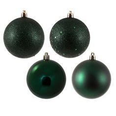 three shiny green christmas ornaments on a white background