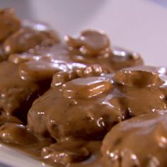 chocolate covered cookies on a white plate