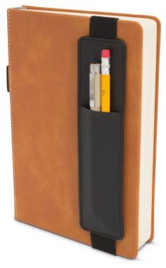 an open notebook with two pens and a bookmark in it's pocket, on a white background