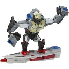 an action figure is shown on a white and red surface with two arms outstretched in the air