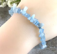 "✦Gemstone: Natural Aquamarine ✦Color: Blue ✦Shape: Chips ✦Wrist size: 5''-7'' ✦QTY: 1 pcs / package Please measure your wrist size, then order the bracelet Natural Blue Aquamarine Chips Bracelet, Healing Crystal, Stretchy String Bracelet, March Birthstone Bracelet, Gift For Women, Bridesmaid Gift Aquamarine evokes the purity of crystalline waters, and the exhilaration and relaxation of the sea. It is calming, soothing, and cleansing, and inspires truth, trust and letting go. The name Aquamarine Adjustable Blue Crystal Bracelet With Stones, Adjustable Blue Gemstone Crystal Bracelet, Adjustable Blue Crystal Gemstone Bracelet, Adjustable Blue Crystal Bracelet With Gemstone, Aquamarine Color, Healing Gemstone Bracelets, Reiki Jewelry, Amazonite Bracelet, Aquamarine Colour