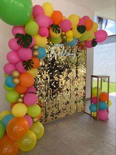 an arch made out of balloons and confetti