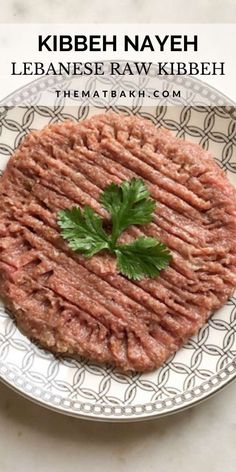 a close up of a plate of food on a table with the words, kibbeh nayeh lebanese raw kibeh