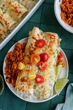 mexican food on a plate with rice and beans