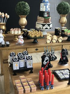 star wars themed desserts and decorations on a table